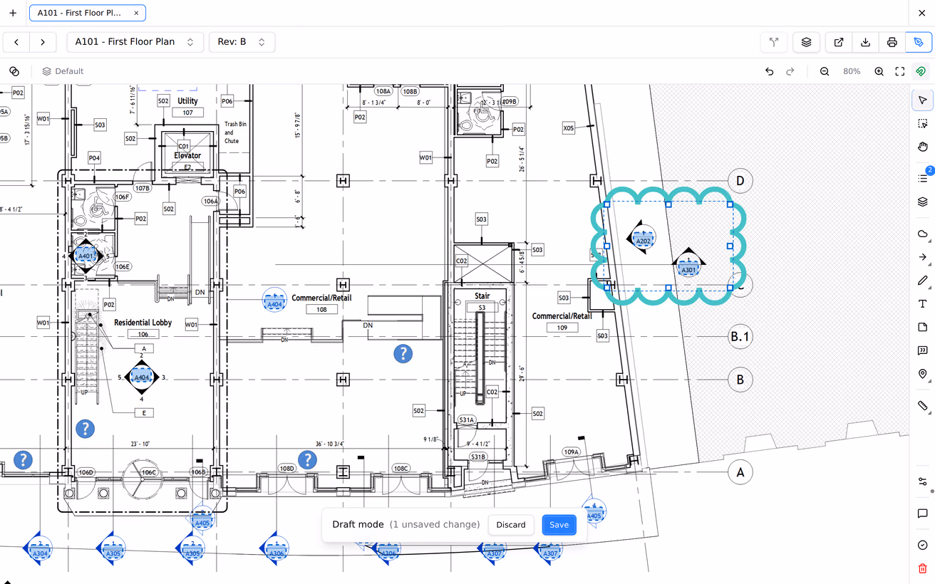 A revision cloud drawn over a drawing detail, selected and showing its handles, then reshaped by dragging a point.